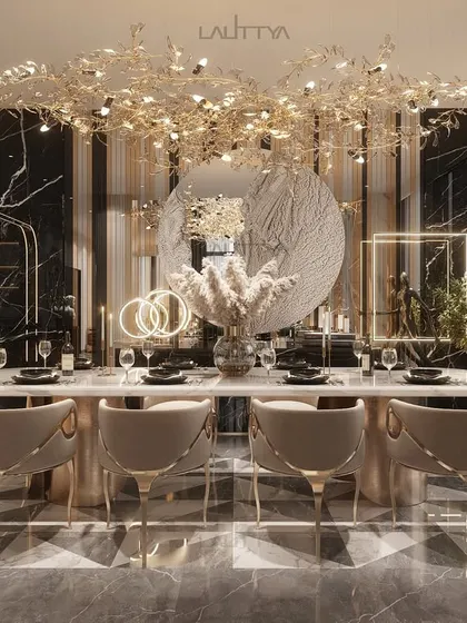 A view of one of our elegantly styled dining rooms. We focus on combining statement lighting, comfortable seating, and high-quality materials like marble and brass to create spaces that are perfect for both everyday meals and special occasions.
