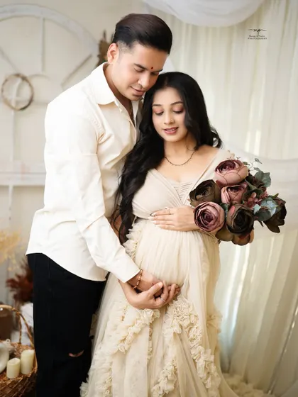 The cutest parents-to-be. This tender moment, with both their hands on the baby bump, is a simple and powerful expression of their shared love and excitement.