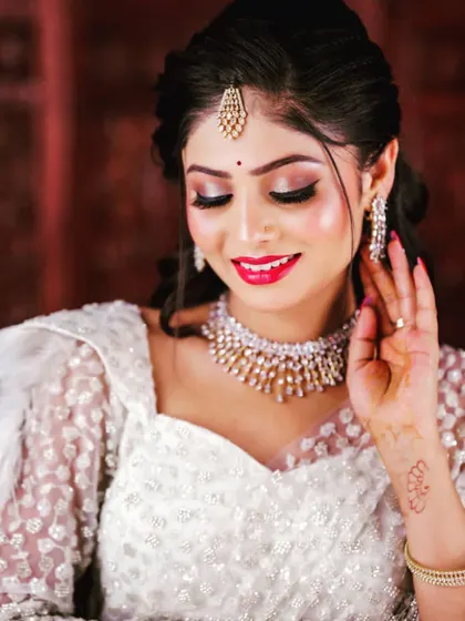 A simple yet elegant CZ choker worn by a model in a white dress. This shows how versatile my pieces are, perfect for any modern outfit.