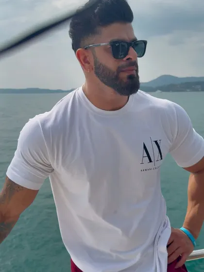 On a boat, enjoying the sea breeze. This is what it's all about: working hard to build a life filled with incredible experiences.