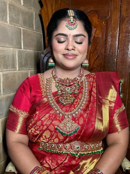 A glimpse into the regal look we crafted for Apoorva. This close-up shows the soft, shimmery eye makeup and the flawless base that makes her look timeless and radiant.