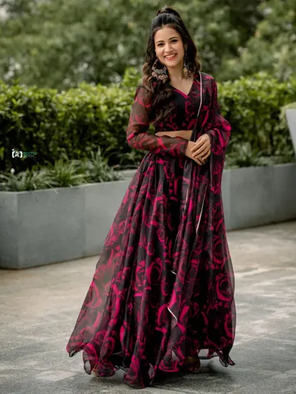 A full-length shot of a stunning floral lehenga. This outdoor portrait showcases the entire outfit, capturing its flow and design in a natural, elegant setting.