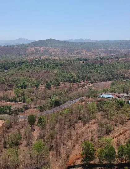 A drone view of the Ridge House site, capturing the vast landscape of the Konkan region that the home is designed to overlook.