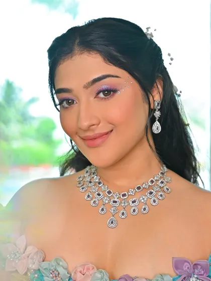 A touch of sparkle on the inner corner of the eye adds to the magical feel of this look. It's a small detail that makes a big impact.