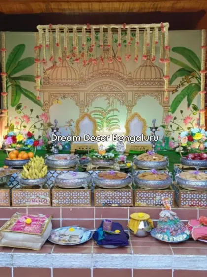 This tonsure ceremony decor features a beautiful Pichwai-style backdrop and an elaborate display of traditional offerings. It was an honor to bring this client's vision to life.