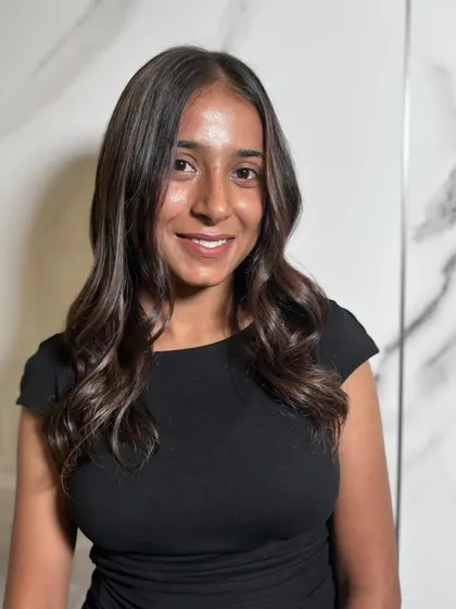 A happy client ready to start her new chapter with fabulous hair.