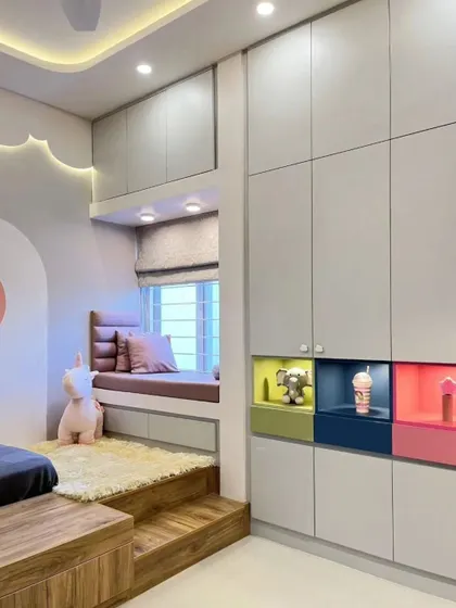 A playful yet practical wardrobe for a kid's room, featuring colorful, backlit display niches for toys and treasures.