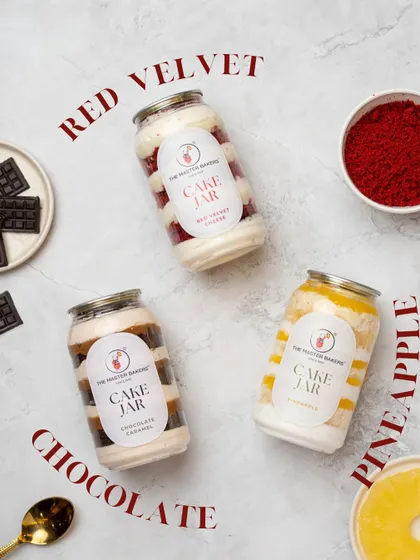 Our Cake Jars are perfect for a single serving of happiness. This shot features our popular Red Velvet, Chocolate Caramel, and Pineapple flavors, each layered with cake and cream for a delightful treat on the go.