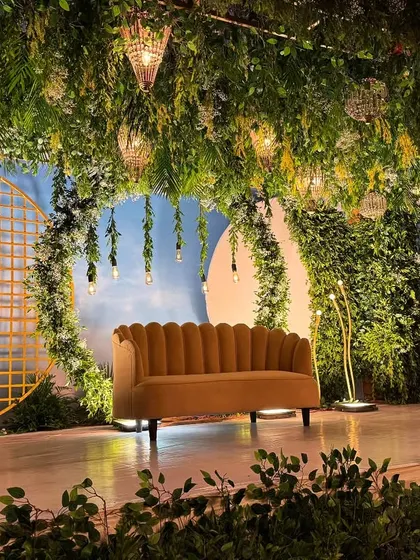 We brought an enchanted forest to life with this magical stage setup. A canopy of lush greenery, hanging lights, and whimsical details created a dreamy, immersive atmosphere for the couple and their guests.