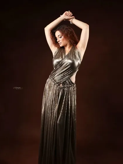 Dressed in a golden gown, she embodies courage and dreams. This portrait session was about creating a powerful, glamorous image that reflects her inner strength and ambition.