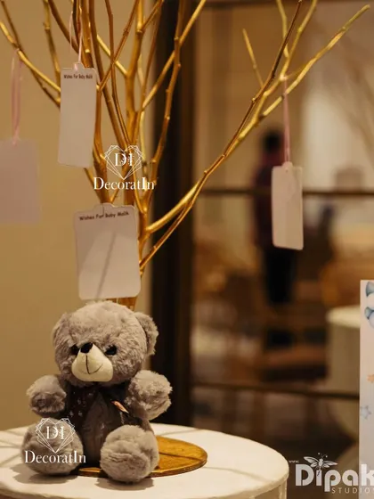 A wishing tree for guests to hang their messages for the new baby.