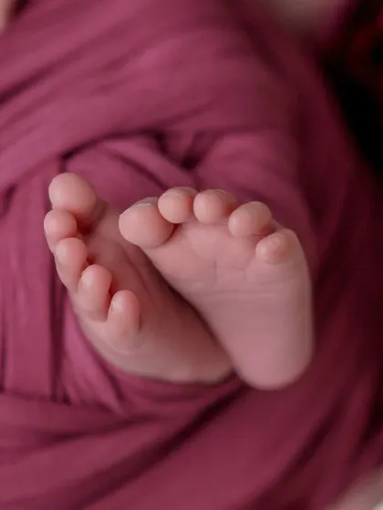 The tiniest footprints. This close-up on a baby's feet, peeking out from a cozy swaddle, is one of my favorite shots to capture.