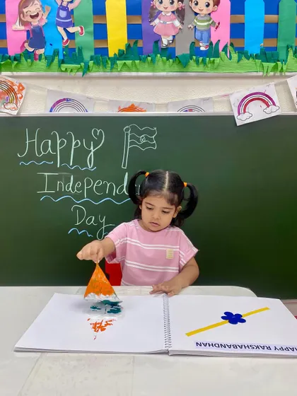 With focused determination, a student creates her Independence Day art. These activities are designed to be fun and accessible for even our youngest learners, fostering an early love for creativity.