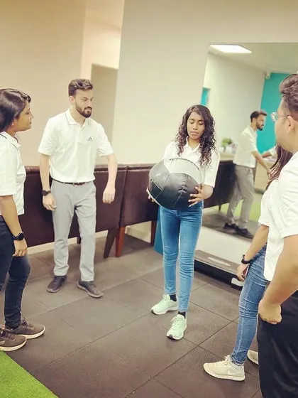 A team training session in progress. Continuous learning is a core value at Arch Physiotherapy.