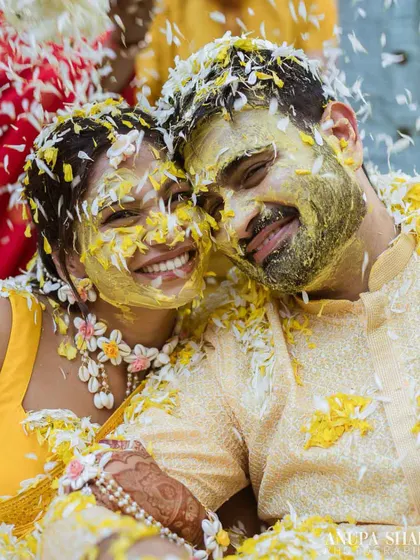 The pure, uninhibited joy of a Haldi ceremony. We love creating vibrant settings with traditional marigolds and flower showers that lead to these priceless, happy moments.