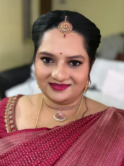 A simple, natural makeup look that radiates elegance. Her smile says it all. This is perfect for clients who want to look polished but still feel like themselves.