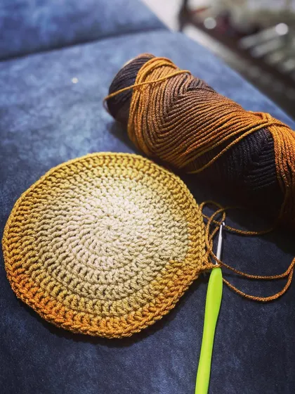 The start of another round bag, this time with a beautiful brown and yellow ombre yarn.