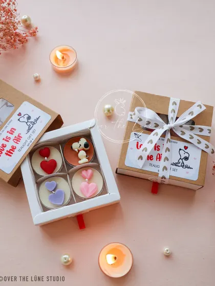 My 'Love is in the Air' tealight gift sets, featuring the most adorable Snoopy and heart-shaped candles. They are available in sets of 4 and 6.