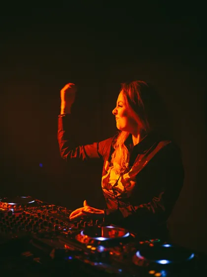A candid shot of me feeling the music during a set. These are the moments of pure joy that I share with the audience.
