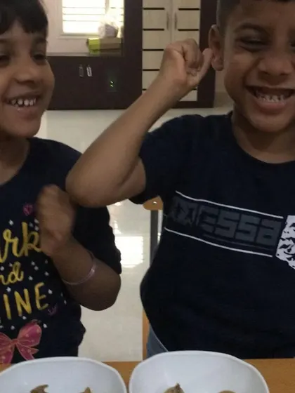 The happy smiles of these children show the fun and camaraderie that can come from a shared activity, even when learning from home.