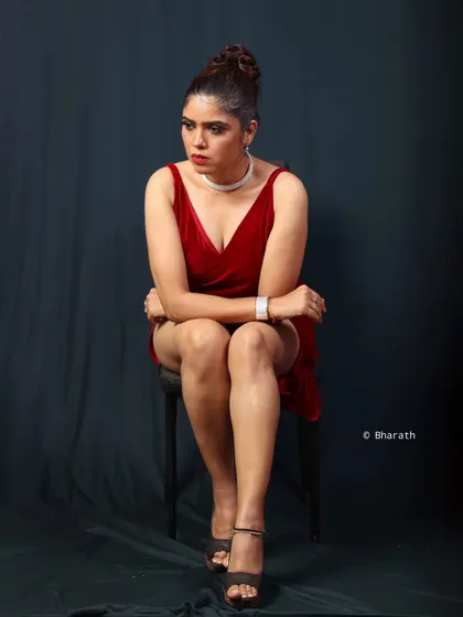 Using a single chair as a prop in the studio, this portrait captures a moment of quiet intensity, with lighting that sculpts and defines.