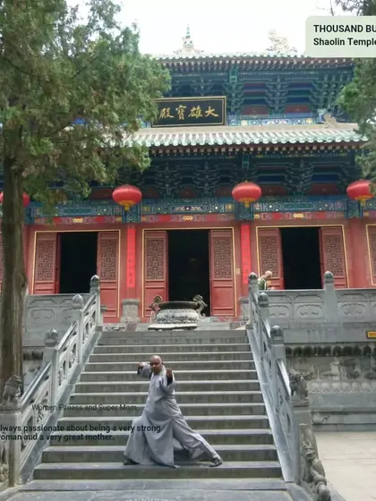 Practicing a Kung Fu stance on the steps of the Thousand Buddha Hall at the Shaolin Temple. This sacred space is a powerful reminder of the deep spiritual roots of our martial practice.