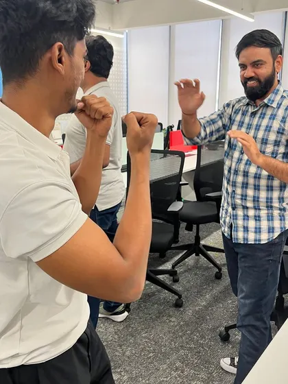 Two participants practicing blocking and striking techniques during our self-defense workshop.