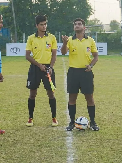 The coin toss before a league match. Our captains ready to lead their teams into battle.