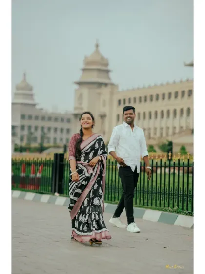 A candid walking shot in front of the Mysore Palace, with the couple looking relaxed and happy. A beautiful way to incorporate a famous landmark into your story.