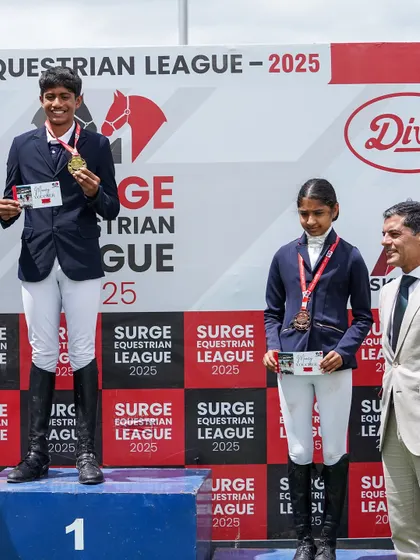 Eshaan stands proudly atop the podium after a double win at the Surge Show, a testament to his hard work and the quality of our dressage training program.