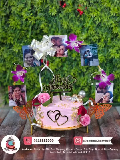 A unique anniversary cake featuring a stand with the couple's photos. This is a wonderful way to showcase your journey together and makes for a truly personal celebration.