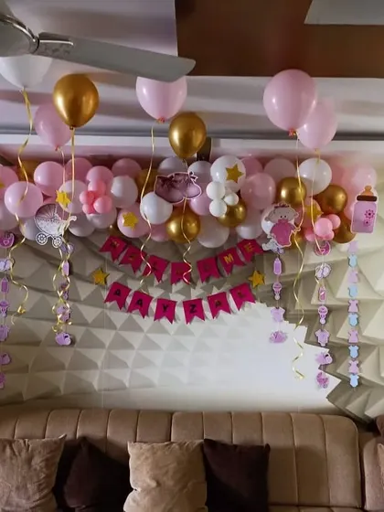 Another angle of the pink and gold welcome baby balloon decor.