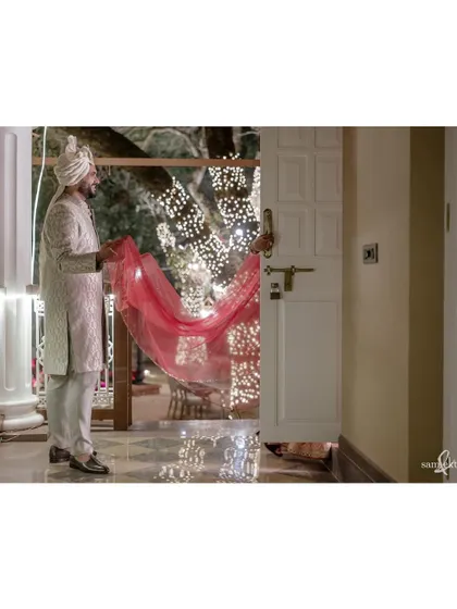 One of the last photos from their wedding, Maahir helps Sanjana with her lehenga as she changes between the ceremony and reception. It’s a quiet, caring gesture that speaks volumes about their partnership.