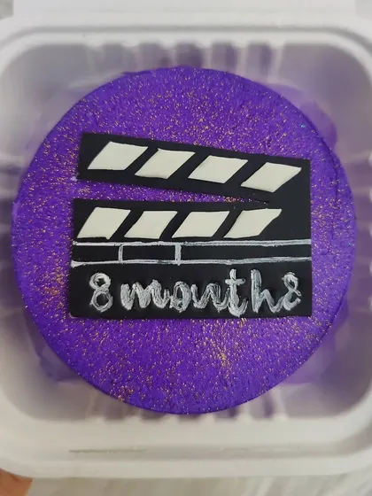 "Lights, camera, action!" An 8-month celebration bento cake with a movie clapperboard theme.