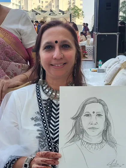 It's always a joy to draw guests who are so full of life. This quick charcoal sketch captures her warm smile. These portraits become great conversation starters during the event.