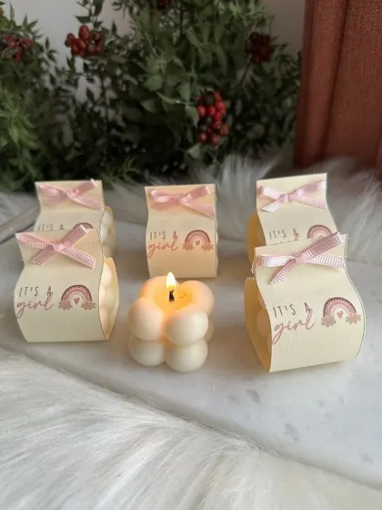 An "It's a Girl" themed bubble candle favor. The custom packaging makes it a sweet and personal announcement gift.