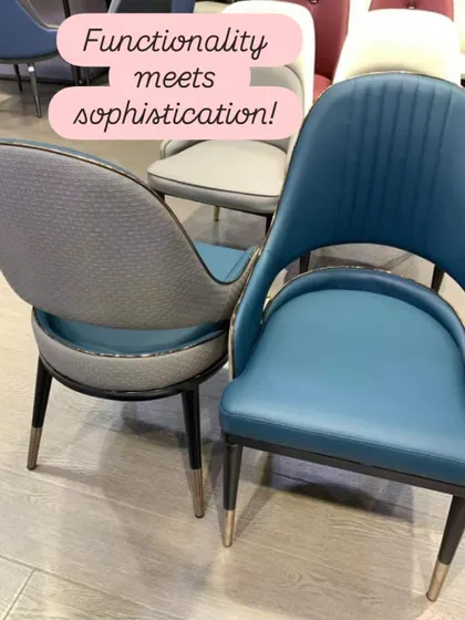 Functionality meets sophistication in these modern dining chairs. The design features a mix of textures, with a smooth blue leatherette front and a textured grey fabric back, all tied together with elegant metal-tipped legs.