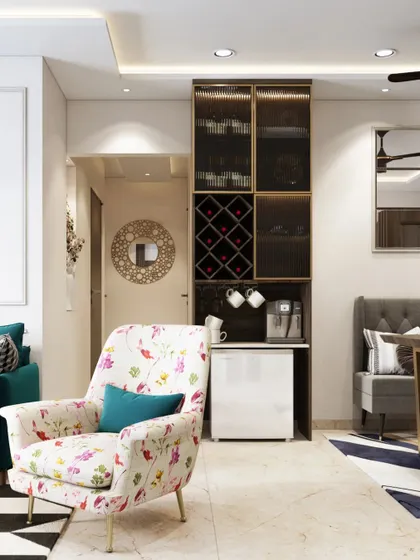 A compact bar unit is cleverly integrated into this living room corner. The floral print armchair adds a touch of softness and color to the space.