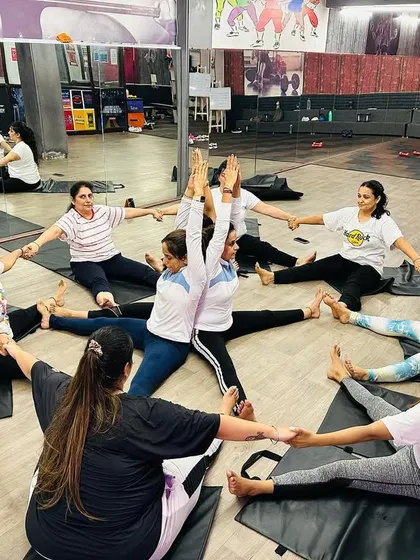 Our entire class joining hands and feet to create a circle of trust and support. This is more than just a yoga pose; it’s a symbol of our strong, interconnected community.