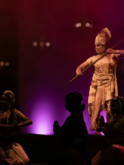 A powerful depiction of a goddess with her weapon, ready for battle.