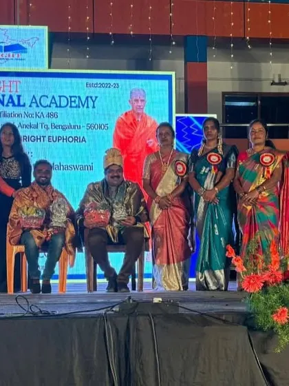 On stage with other guests during a felicitation at Bright International Academy in Jigani. It was an honour to be recognized at their event.