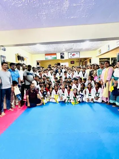 Another great photo with the parents and students, capturing the community spirit of our dojang.