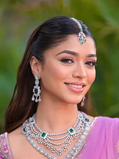 For this beautiful bridal look, I did a classic half up, half down style. It’s elegant, timeless, and keeps the hair looking soft and romantic.