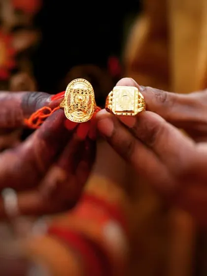 A close-up of the bride and groom's hands showcasing their wedding rings. This is a classic shot that symbolizes their union and the promises they've made to each other.