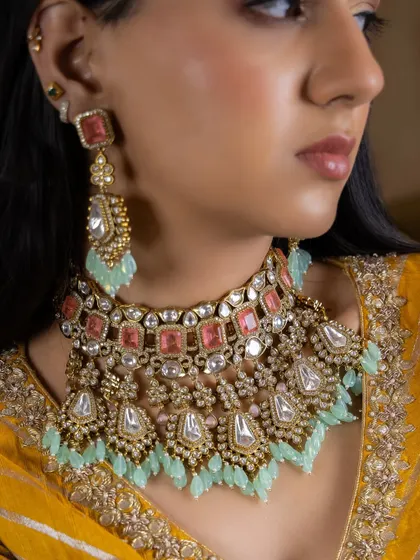 A beautiful pastel-toned Kundan choker set with pink and mint green stones. This is a wonderful option for a bride looking for a softer color palette for her wedding day.