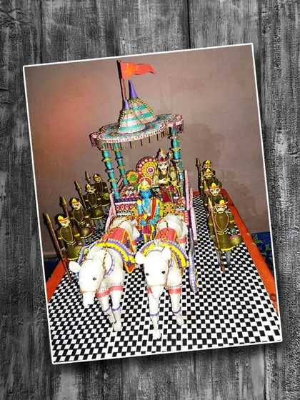 A magnificent 3D paper quilling masterpiece by Neha Kumari, depicting the chariot of Krishna and Arjuna from the Mahabharata. The entire scene, including the horses and soldiers, is crafted from rolled paper, showcasing phenomenal skill and dedication.
