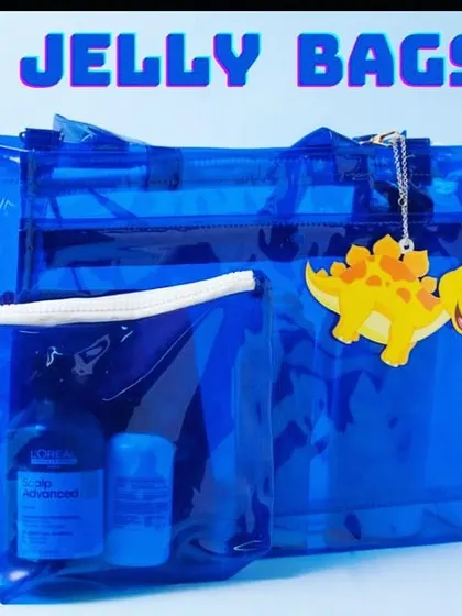 A close-up of our royal blue jelly bag, complete with a dinosaur charm. It's a great gift for boys and girls alike.