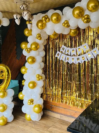 A full view of the white and gold 19th birthday setup.