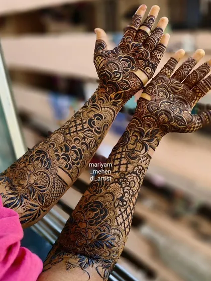 A stunning view of a full-arm bridal mehendi, perfect for making a statement.