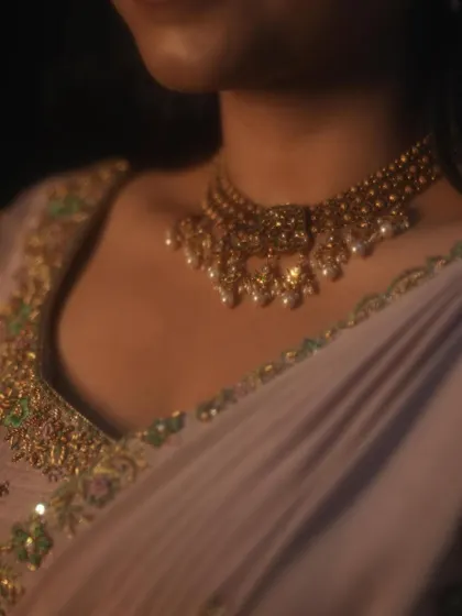 Dr. Tushara looking effortlessly elegant. This close-up shows the delicate embroidery along the neckline of her blouse, proving that style and grace can be a part of everyday life.